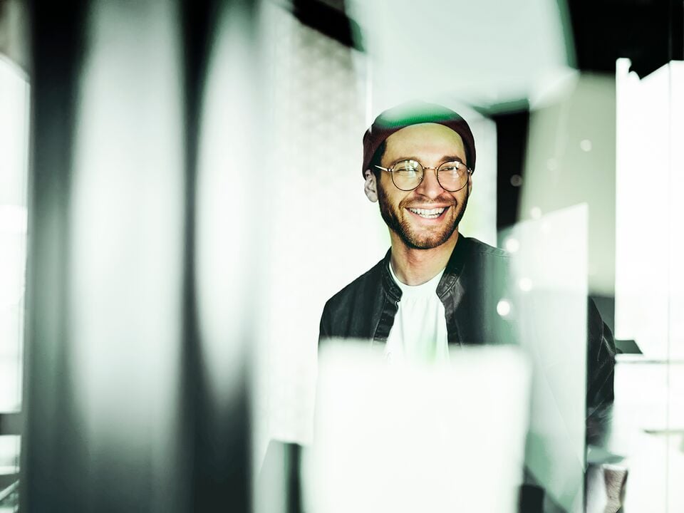 Man in glasses smiling