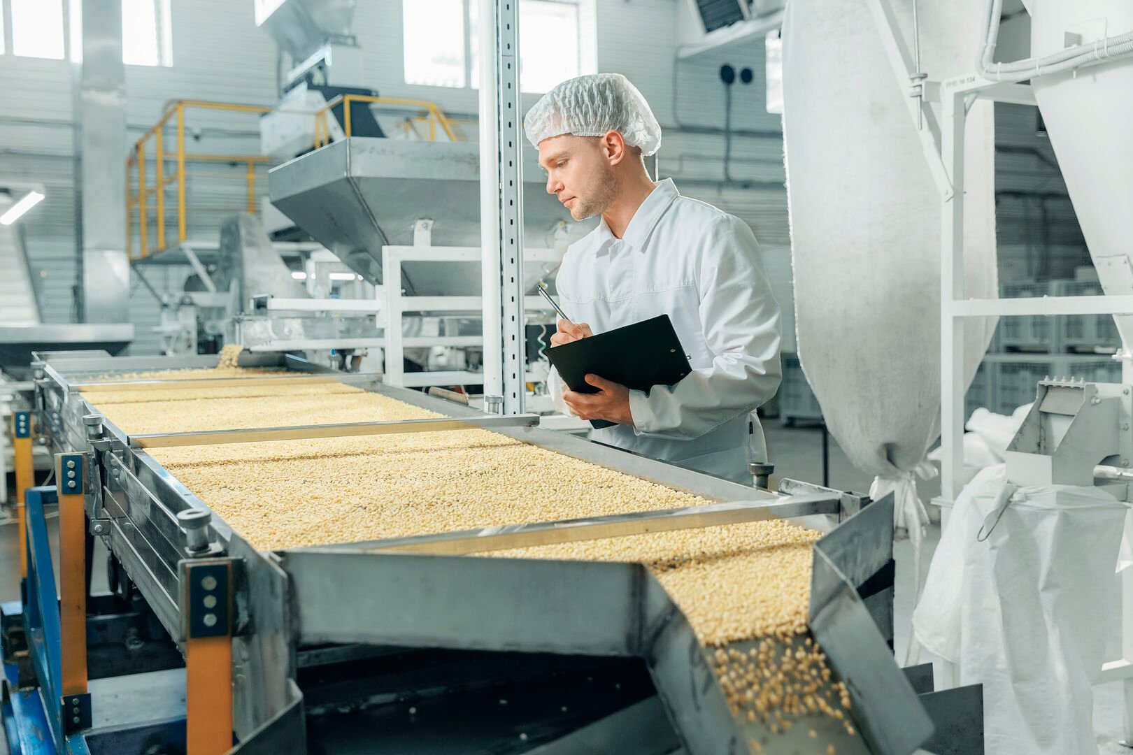 Man overseeing food production in a factory