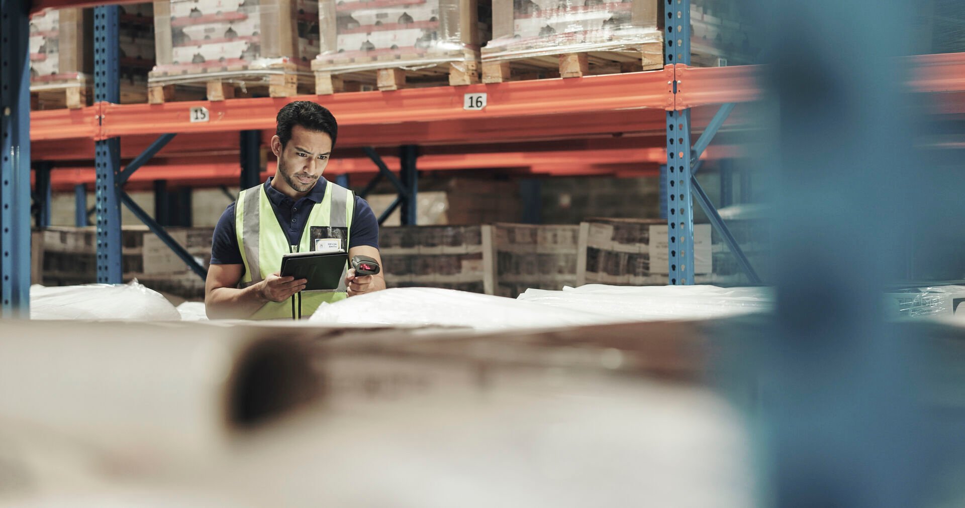 Man in warehouse taking inventory