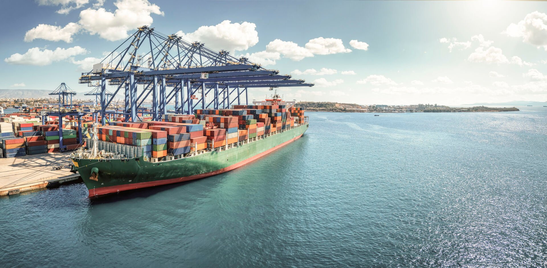 Ship by a harbor transporting goods