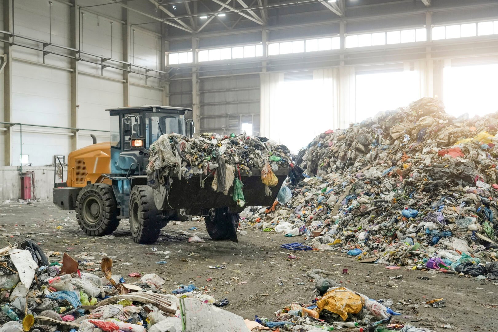 Truck picking up waste