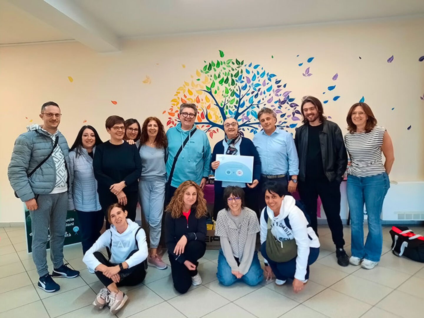 Group photo of the Italian team with FCR colleagues at Associazione Amici Casa dell'Accoglienza during CamfilCairing Week 2026.