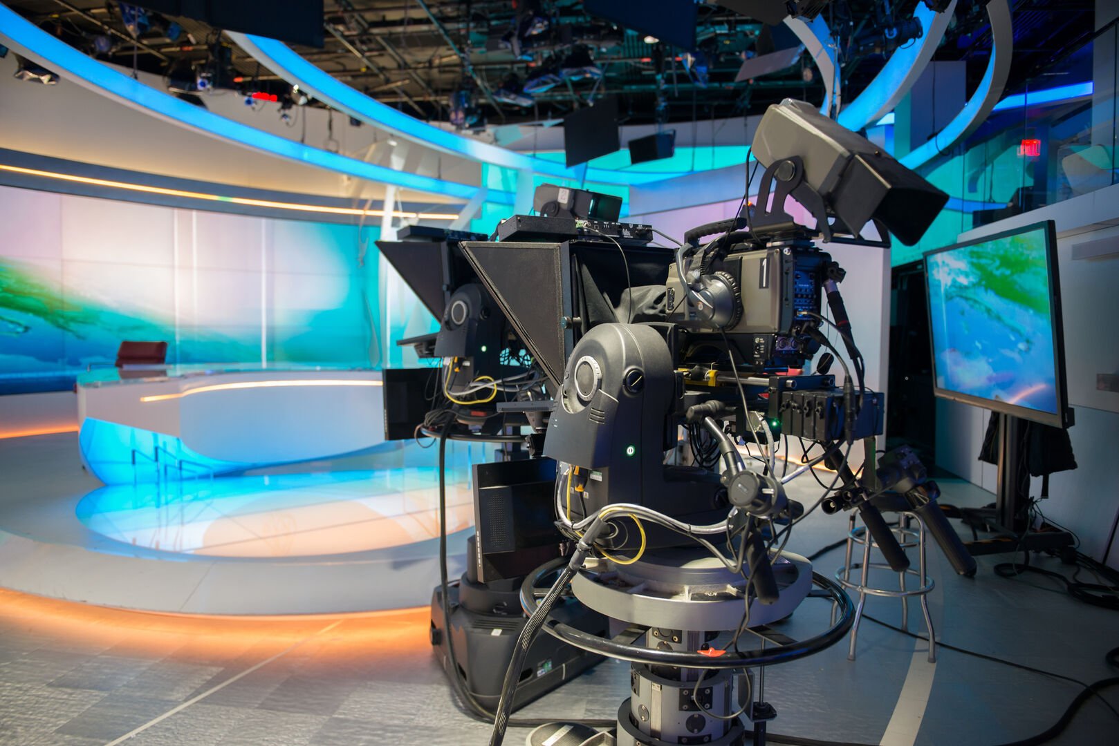 TV NEWS cast studio with camera and lights.